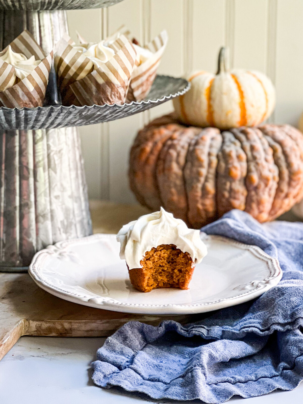 pumpkin cupcake with bight out and pumpkins