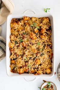 butternut squash casserole in a white dish