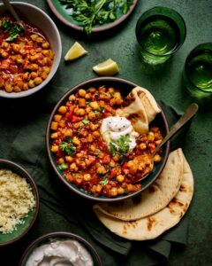 vegetable and chick pea tagine in a bowl with naan