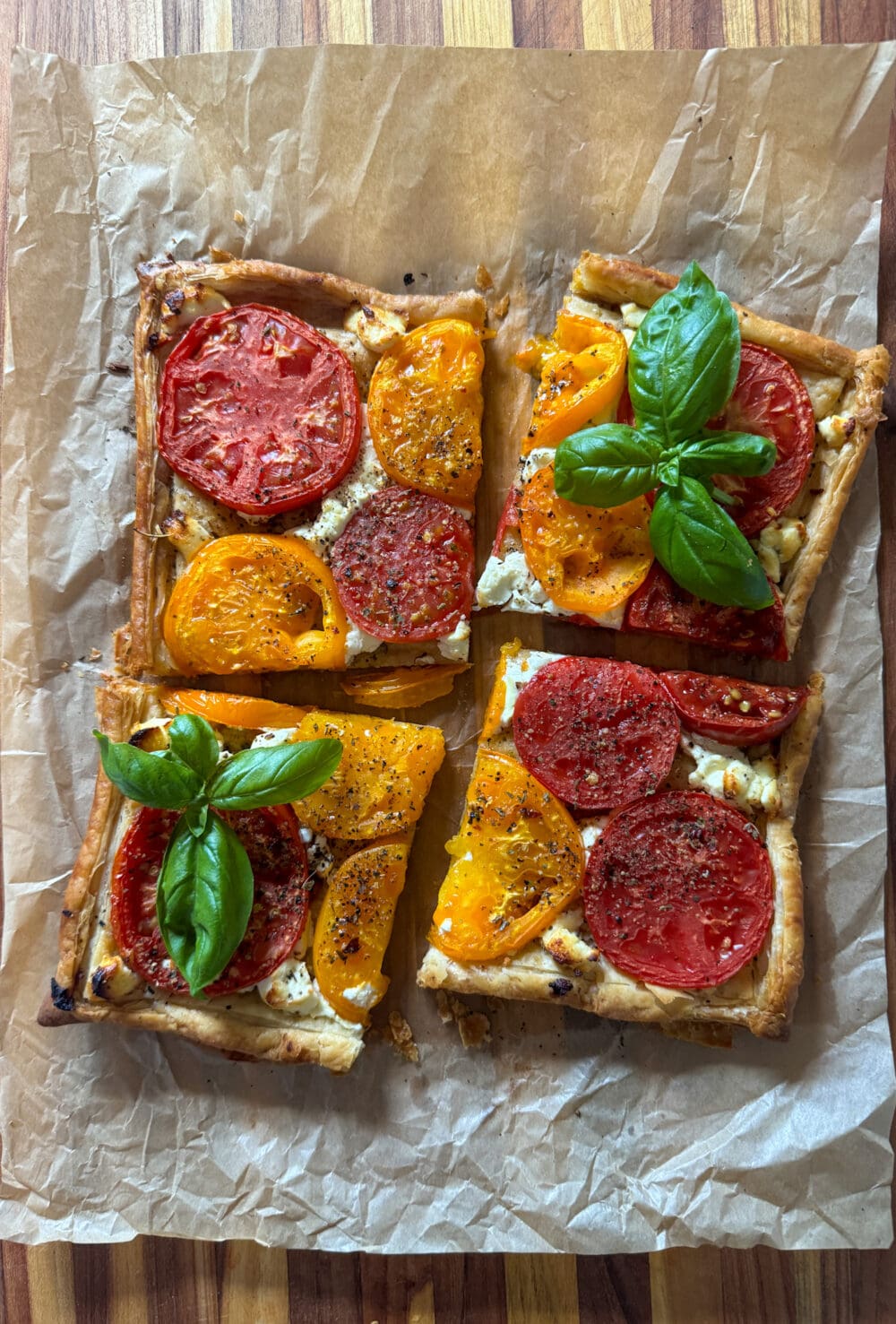 A goat cheese tomato tart cut into 4 pieces