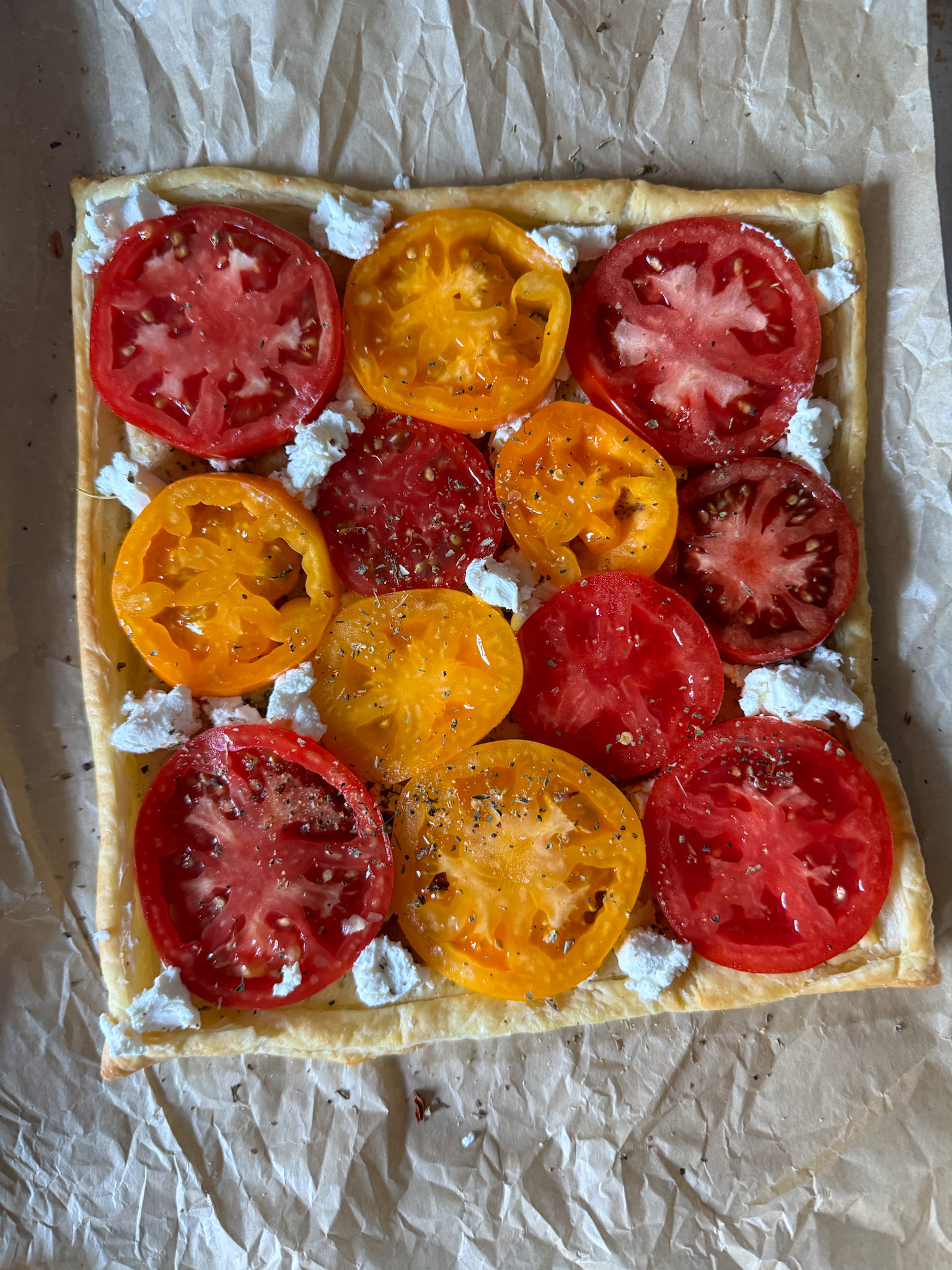 Tomato tart with goat cheese before final bake