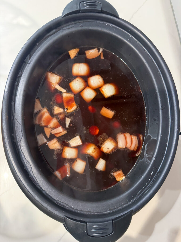 broth, carrots, onions and chuck roast in slow cooker