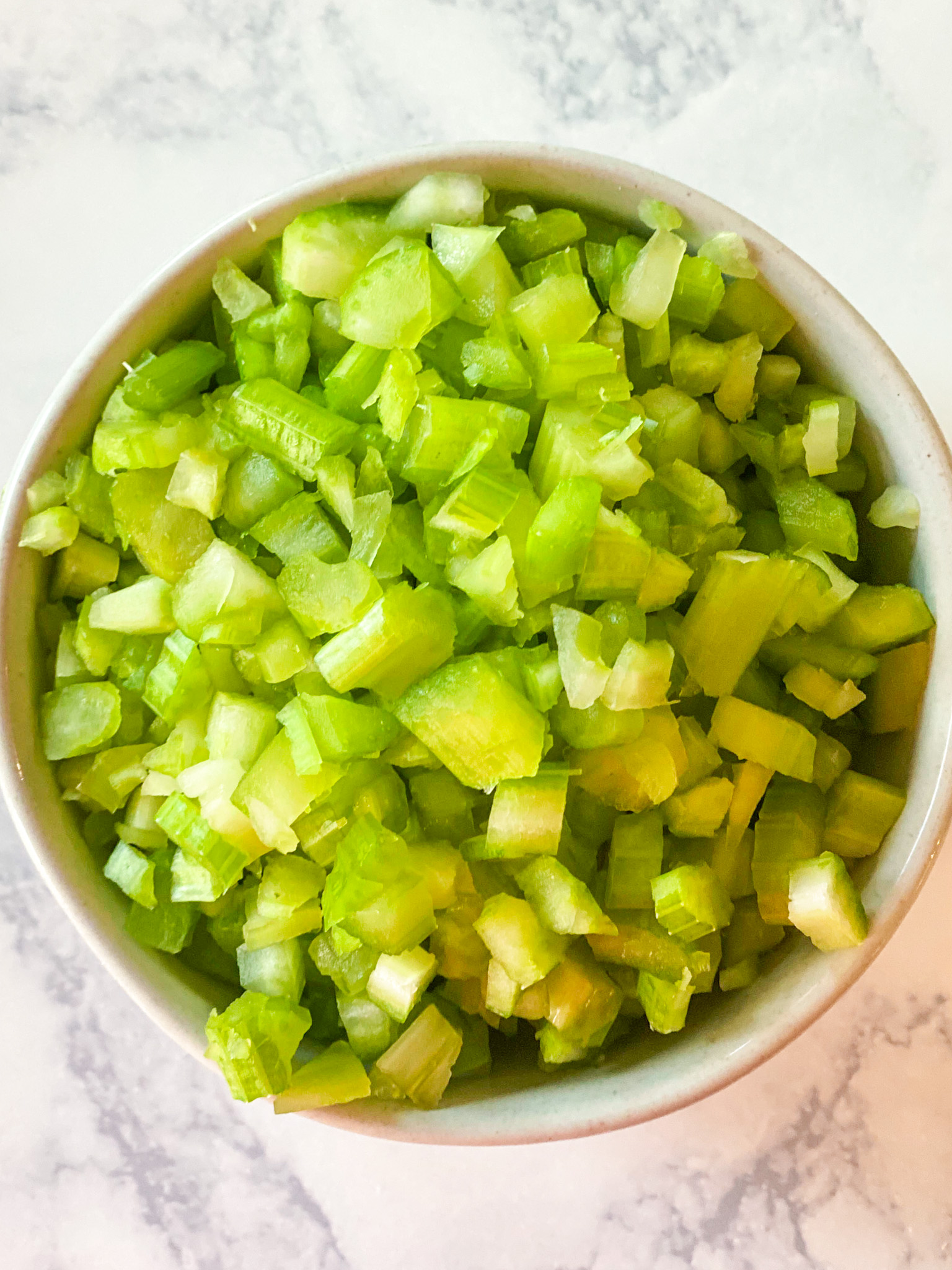 chopped celery in a bowl