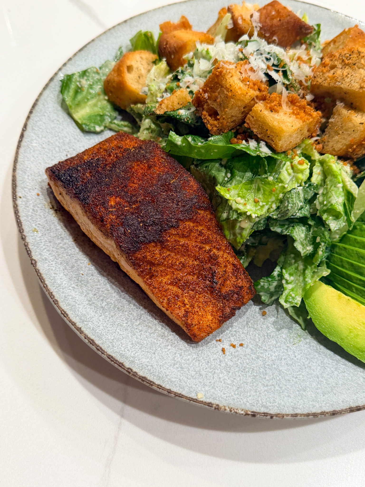 blackened salmon and salad with croutons