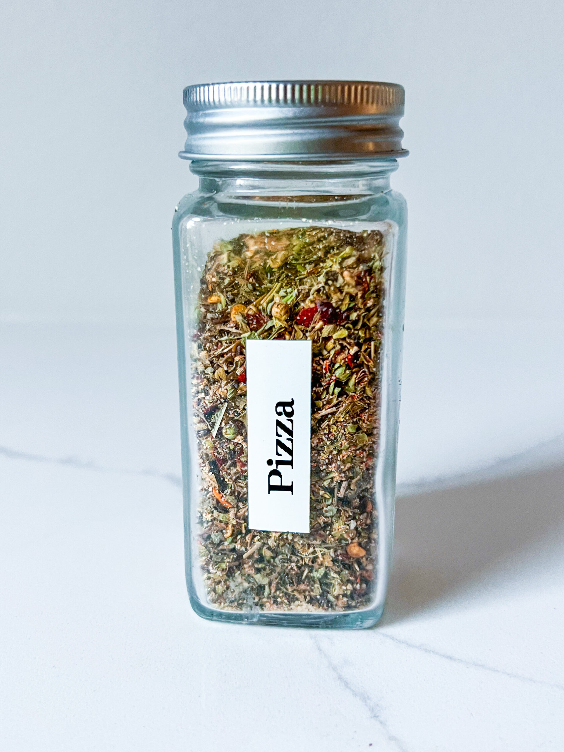 pizza seasoning in a jar with a label