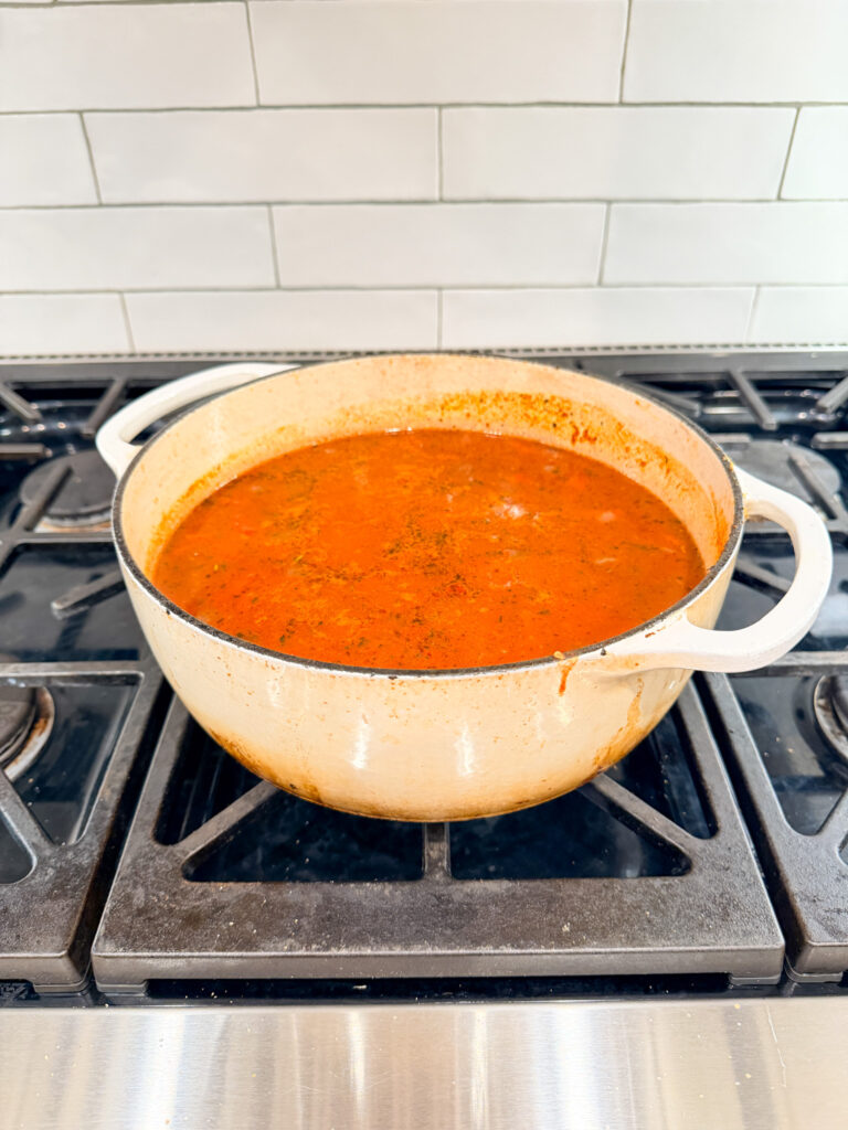 tomato soup in a pot on a stove