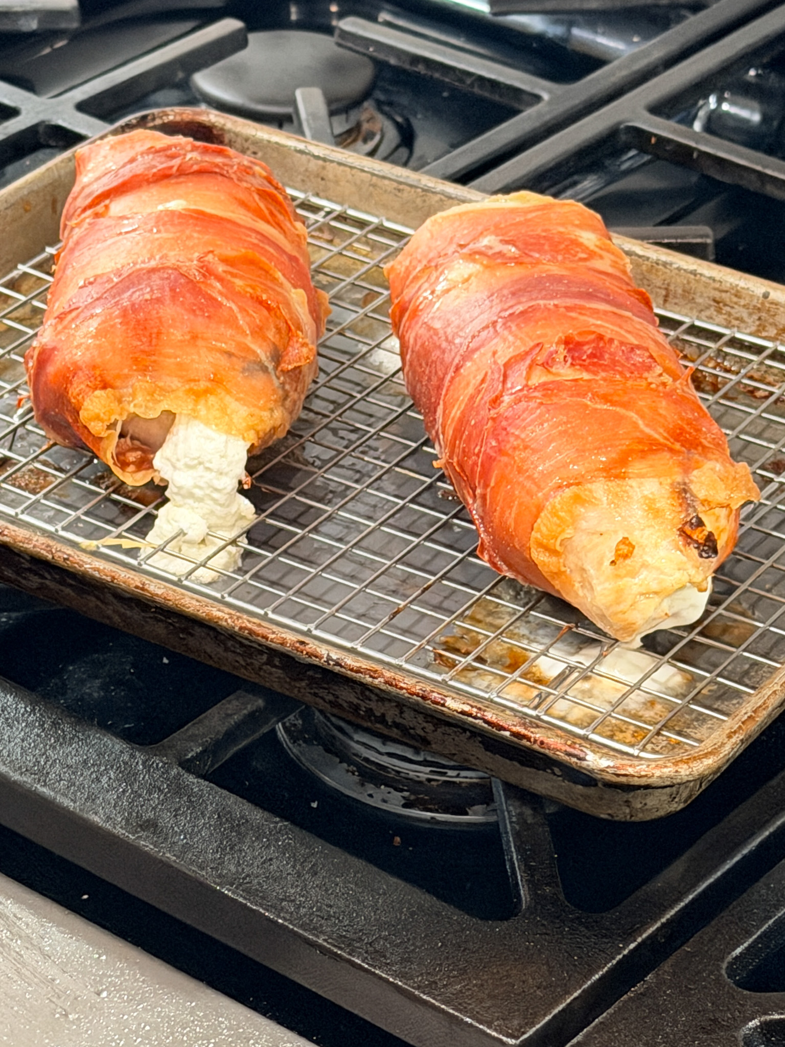 cooked proscuiotto wrapped goat cheese stuffed chicken