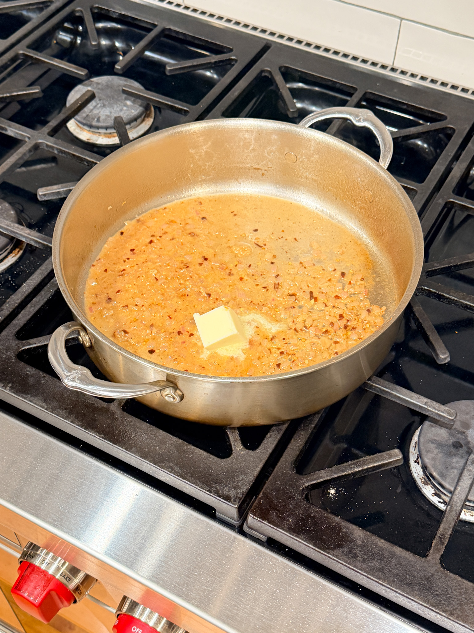 butter in pan with deglazed shallots