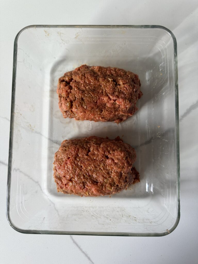 mini meatloaves formed in a glass pan