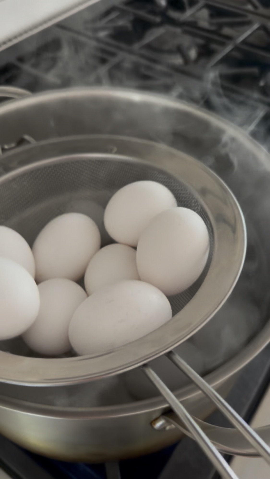 hardboiled eggs going into strainer
