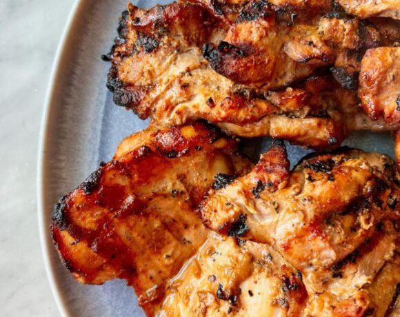 Grilled chicken thighs on q blue platter
